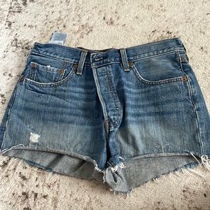 Levi’s cut off denim shorts. Not sure of the size, likely a 29.